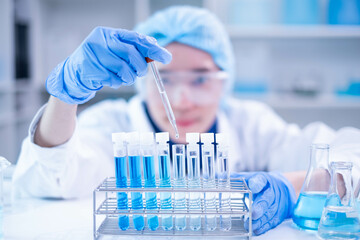 Professional scientist chemist technician analysis research experiment virus blue liquid pipette...
