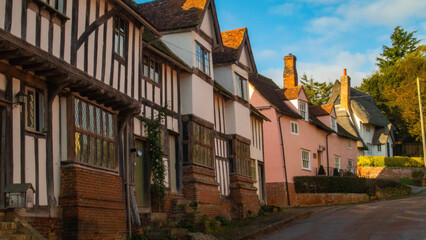Older British homes in small village with clear blue skies