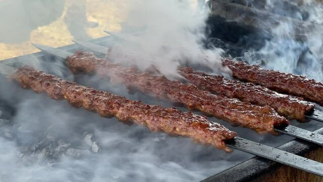  Turkish Kebab On The Grill. Barbecue grliling shish kebab , shish kebab in smoke over coal fire
