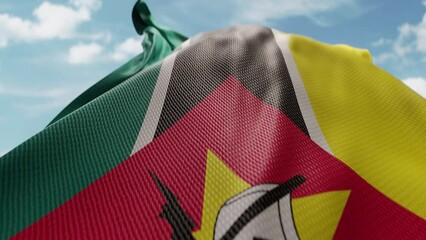 Wavy flag of Mozambique blowing in the wind in slow motion. Waving official Mozambican flag team symbol abstract vertical background. Blue sky with clouds. World countries flying flags concept