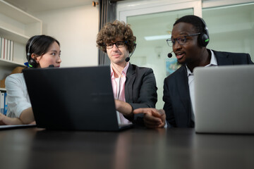 Group of business people wearing headset working actively in office. Call center, telemarketing,...