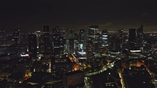 Paris at night: a tapestry of lights where commerce thrives amidst iconic structures.
