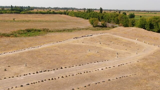 Ancient gravestones called balbals near Bunara Tower in Kyrgyzstan