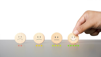 Customer service and Satisfaction concept, Business people choose happy Smiley face icon to give satisfaction in service. rating very impressed.