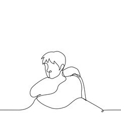 man sits hugging himself - one line art vector. concept melancholy, sadness