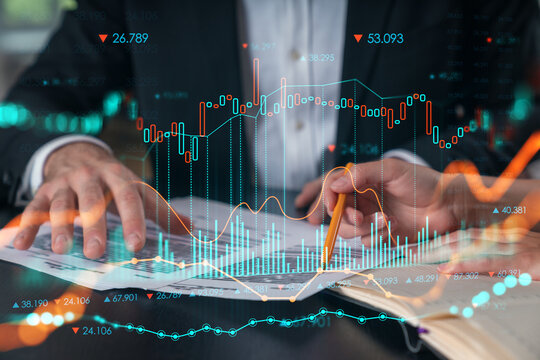 Businesspeople in formal wear taking notes signing contract at office workplace. Concept of important working moments, document sign, working process, concentration. Hands shot. Financial charts