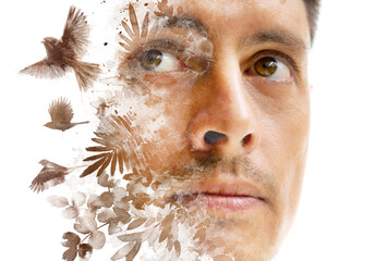 A paintography man's portrait combined with flying birds and foliage painting