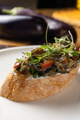 Delicious bruschetta with vegetables and meat