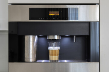 Built-in automatic coffee machine in kitchen furniture