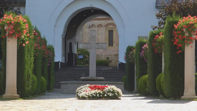 Francesti Monastery entrance alley surrounded by beautiful gardens
