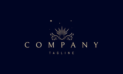 A vector golden logo with an abstract image of angel wings with a sun in the middle.