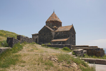 Beautiful view of the Sevan mountain lake. The ancient Church of Armenia.