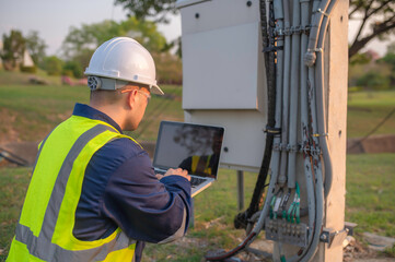 Telecommunication engineers work at cell towers for 5G cell phone signals,Network tower maintenance...