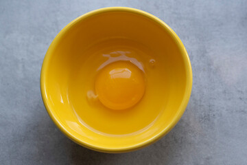 egg in yellow bowl 