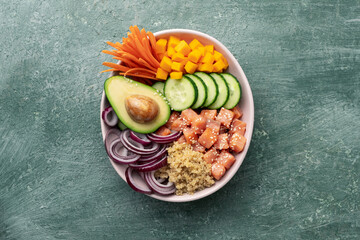 poke bowl salmon with quinoa and vegetables, healthy nutrition, top view