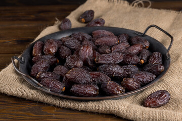 large dates in an iron plate