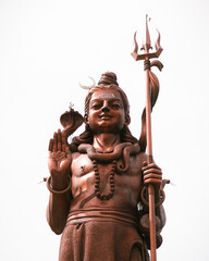 The giant Shiva statue of Durga at the Hindu temple Ganga Talao, Grand Bassin, Mauritius. close-up...
