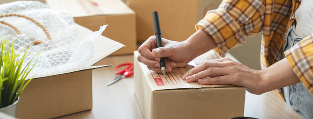 Careful Packaging: Expert Hands Ensuring Secure Shipping for Online Store Products