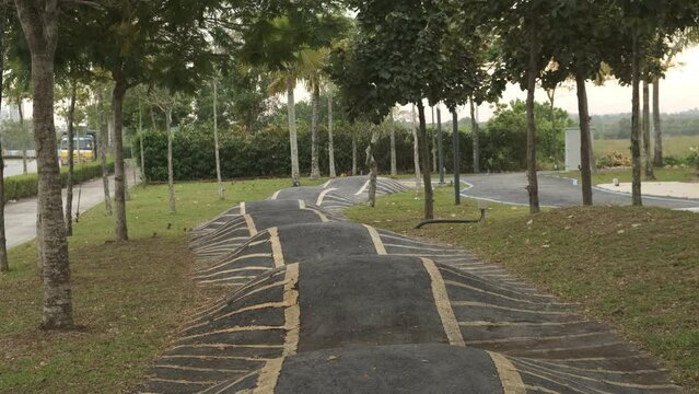 A handheld footage with noise effect of public bicycle park bumpy section before raining weather