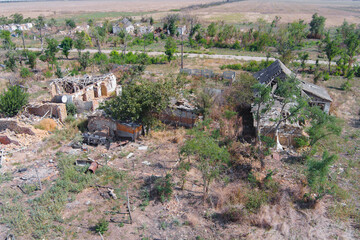 An aerial view of a destroyed village in the countryside after a battle. War in Ukraine