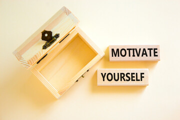 Motivate yourself symbol. Concept words Motivate yourself on beautiful wooden blocks. Beautiful white background. Empty wooden chest. Business psychology motivate yourself concept. Copy space.