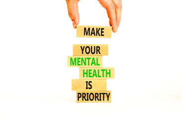 Mental health psychological symbol. Concept words Make your mental health a priority on wooden...