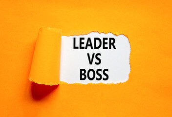 Boss vs leader symbol. Concept words Boss vs versus leader on beautiful white paper. Beautiful orange background. Business motivational boss vs leader concept. Copy space.