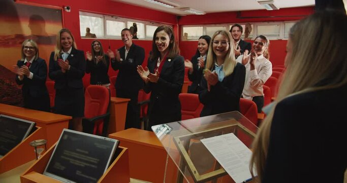 Standing ovation to student passing her diploma