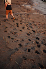 the boy's summer travels on the river, footprints on the clay stove from his feet