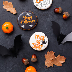 Happy Halloween. Trick OR Treat. Gingerbread cookies on dark stone background. Sweets for Halloween party - 649007751