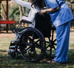Asian young woman nurse at nursing home take care disabled senior man. Caregiver doctor serve physical therapy for older elderly patient to exercise and practice walking on walker or cane at backyard.