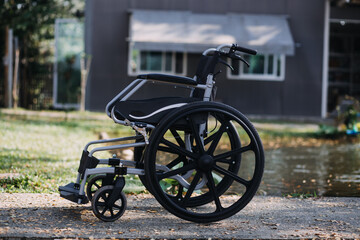 Asian young woman nurse at nursing home take care disabled senior man. Caregiver doctor serve physical therapy for older elderly patient to exercise and practice walking on walker or cane at backyard.