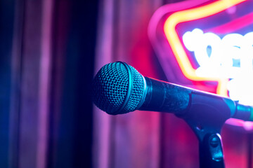 Microphone on the background of neon light
