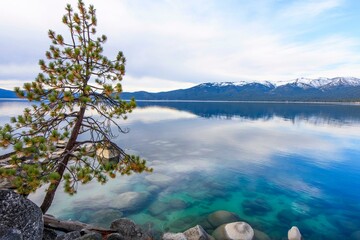 Tranquil Tahoe Beauty: 4K Image of Lake Tahoe View from Lakeshore with Stone and Sky