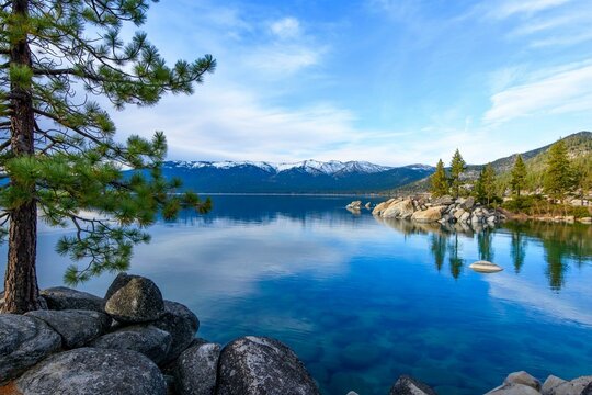 Tranquil Tahoe Beauty: 4K Image of Lake Tahoe View from Lakeshore with Stone and Sky