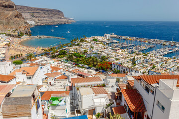 Puerto de Mogan town on the coast of Gran Canaria island, Spain. - 649016963