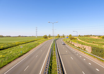 Fototapeta premium An empty rural road in a polder landscape