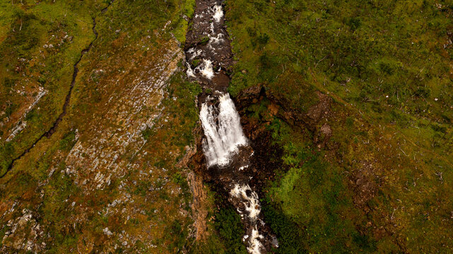 Aerial view of a salmon river in Norway with waterfall. created without Ai