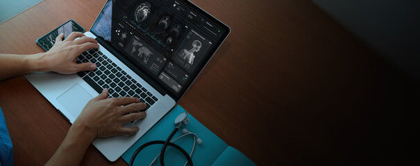 Above view of Doctor using technology document management on computer system management for cardiologist Specialist in treating heart disease for treatment in hospital . - 649024318