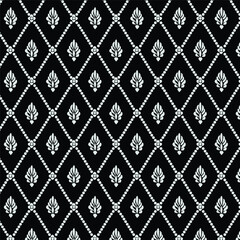 A black and white pattern with leaves