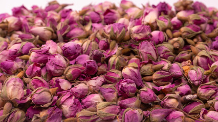 Dry tea roses isolated on white background.