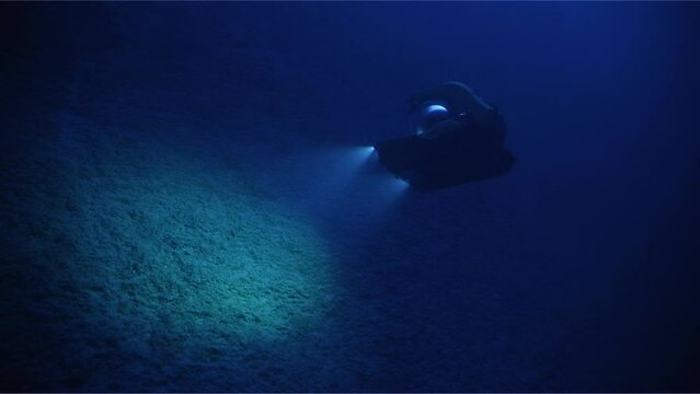 Submarine Shining Lights On Underwater Floor