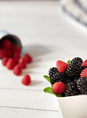 Close-up of delicious raspberries and blackberries. Healthy food.