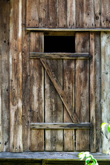 An old homemade massive door, a fragment of an old estate.