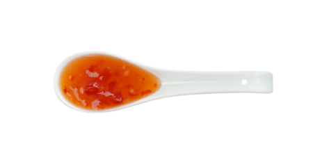 Chili sauce in spoon top view isolated on transparent.