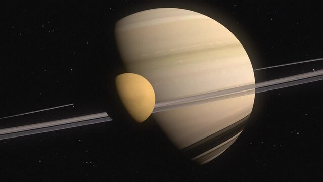 Planet Saturn with the moon Titan orbiting in foreground