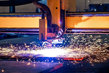 Fotobehang Sparks of plasma cutting machine, thick metal cutting, metal cut process, carpentry metalwork industry © Uldis Laganovskis