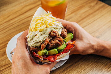 Arepa with many ingredients