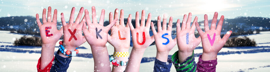 Children Hands Building Word Exklusiv means Exclusive, Winter Background