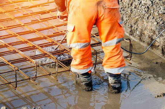 Builder using electric braker fot breaking concrete from the top of pile to fit reinforcement cage on top of it